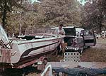Man working on boad on trailer Man working on boad on trailer